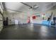 Spacious garage with epoxy flooring, washer, and ample storage at 9832 Florida Boys Ranch Rd, Clermont, FL 34711