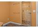 Bathroom with a large walk-in shower, tiled walls, and stone floor at 9832 Florida Boys Ranch Rd, Clermont, FL 34711