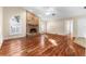 Living room with hardwood floors and brick fireplace at 3064 Windham Dr, Eustis, FL 32726