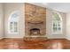 Brick fireplace with a large hearth and a decorative mantle at 3064 Windham Dr, Eustis, FL 32726