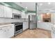 Updated kitchen featuring stainless steel appliances and white shaker cabinets at 3064 Windham Dr, Eustis, FL 32726