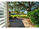 Brick patio with access to a lush, green backyard at 3064 Windham Dr, Eustis, FL 32726