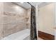 Clean bathroom with tile shower/tub combo and built-in shelves at 3064 Windham Dr, Eustis, FL 32726