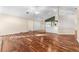 Living room with hardwood floors and view of kitchen at 3064 Windham Dr, Eustis, FL 32726