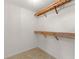 Large closet with wooden shelves, offering great storage space at 3064 Windham Dr, Eustis, FL 32726