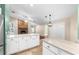 Modern kitchen with white cabinets and granite countertops at 3064 Windham Dr, Eustis, FL 32726