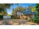 Home exterior with a two-car garage and fenced yard at 3064 Windham Dr, Eustis, FL 32726