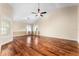 Spacious bedroom with hardwood floors and a ceiling fan at 3064 Windham Dr, Eustis, FL 32726