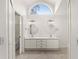 Double vanity bathroom with updated fixtures and a large window at 3064 Windham Dr, Eustis, FL 32726