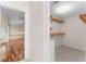 Spacious walk-in closet with built-in shelves, providing ample storage at 3064 Windham Dr, Eustis, FL 32726