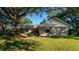Ranch style home with a large backyard and mature shade tree at 3064 Windham Dr, Eustis, FL 32726