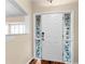 Bright entryway with hardwood floors and a charming stained-glass door at 3064 Windham Dr, Eustis, FL 32726