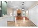 Spacious living room with hardwood floors and a brick fireplace at 3064 Windham Dr, Eustis, FL 32726