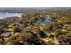 Aerial view showcasing home's location near a lake at 3064 Windham Dr, Eustis, FL 32726