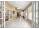 Bright sunroom with tile floors and access to the backyard at 3064 Windham Dr, Eustis, FL 32726