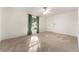 Bright bedroom with neutral carpeting and ceiling fan at 3064 Windham Dr, Eustis, FL 32726