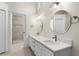 Double vanity bathroom with updated fixtures and a walk-in shower at 3064 Windham Dr, Eustis, FL 32726