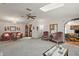 Open living area with two seating areas and a view of the kitchen at 25504 Belle Alliance, Leesburg, FL 34748