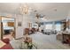 Bright living room with ample seating and a chandelier at 25504 Belle Alliance, Leesburg, FL 34748