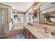 Bathroom with double vanity, jacuzzi tub, and separate shower at 25504 Belle Alliance, Leesburg, FL 34748