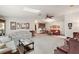 Living room with plush seating and decorative wall art at 25504 Belle Alliance, Leesburg, FL 34748