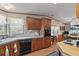 Kitchen boasts ample cabinetry, a corner sink, and a built-in oven at 25504 Belle Alliance, Leesburg, FL 34748
