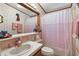 Small bathroom with single sink and shower/tub combo at 25504 Belle Alliance, Leesburg, FL 34748