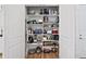 Storage room with extensive shelving for kitchen appliances and tools at 5096 Greens Dr, Lady Lake, FL 32159