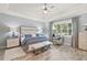 Spacious main bedroom with a king-size bed and large windows at 5096 Greens Dr, Lady Lake, FL 32159