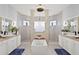 Spa-like Primary bathroom with soaking tub and double vanity at 5096 Greens Dr, Lady Lake, FL 32159