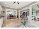 Open concept sunroom showcasing kitchen, dining, and living areas at 5096 Greens Dr, Lady Lake, FL 32159