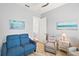 Relaxing sitting area with comfy seating and large windows at 5096 Greens Dr, Lady Lake, FL 32159