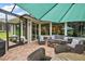 Outdoor patio with seating and a view into the home's interior at 5096 Greens Dr, Lady Lake, FL 32159