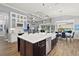 Open concept kitchen with breakfast nook and island at 5096 Greens Dr, Lady Lake, FL 32159