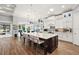 Gourmet kitchen with large island and white cabinetry at 5096 Greens Dr, Lady Lake, FL 32159