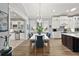 Kitchen dining area with white table and blue chairs at 5096 Greens Dr, Lady Lake, FL 32159
