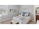 Cozy bedroom with a full-size bed, window seat, and built-in shelving at 5096 Greens Dr, Lady Lake, FL 32159