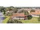 Aerial view of a two-story townhome with a screened balcony and backyard at 5279 Bowline Ct, Oxford, FL 34484
