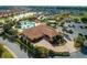 Resort-style community pool with a clubhouse and surrounding landscape at 5279 Bowline Ct, Oxford, FL 34484