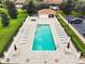 Inviting community pool with lounge chairs and a spa at 5279 Bowline Ct, Oxford, FL 34484