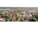 Aerial perspective of a community featuring townhouses, a pool, and a large lake at 5279 Bowline Ct, Oxford, FL 34484