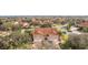 Aerial view of the property showcasing a two-story home with tile roof and double garages at 5279 Bowline Ct, Oxford, FL 34484