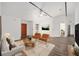 Living room with hardwood floors and staged furniture at 2101 Sw 3Rd St, Ocala, FL 34471