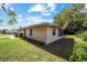 Side view of the house showing landscaping and backyard at 2101 Sw 3Rd St, Ocala, FL 34471