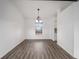 Bright dining room with hardwood floors and chandelier at 2101 Sw 3Rd St, Ocala, FL 34471
