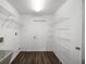 Laundry room with ample shelving and a utility sink at 2101 Sw 3Rd St, Ocala, FL 34471