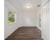 Spacious bedroom with wood-look floors and access to the outdoors at 2101 Sw 3Rd St, Ocala, FL 34471