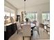 Elegant dining room with a round table and upholstered chairs at 119 Crescent Moon Dr, Groveland, FL 34736