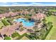 Community pool and clubhouse with lush landscaping at 119 Crescent Moon Dr, Groveland, FL 34736