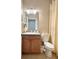 Clean bathroom with single sink vanity and toilet at 119 Crescent Moon Dr, Groveland, FL 34736